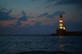 Evening view after sunset of the lighthouse at the entrance of the port of Xania Royalty Free Stock Photo