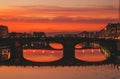 Evening view to Arno river with bridges and reflections in Florence, Italy Royalty Free Stock Photo