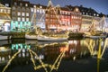 Evening view to boats in front of colourful old houses at Nyhavn harbour canal in Copenhagen, Denmark. February 2020 Royalty Free Stock Photo