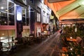 Evening view to cafes in colourful old houses at Nyhavn harbour canal in Copenhagen, Denmark. February 2020 Royalty Free Stock Photo