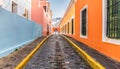 Cobblestone street and colorful houses in city centre of Old San Juan, Puerto Rico.