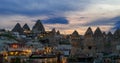 Evening view of the village of Goreme in Cappadocia on the background of the natural terrain and the evening sky Royalty Free Stock Photo