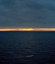 Evening view of the Volga river surface against the backdrop of the sunset sky and clouds