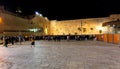 Evening view of Western Wall Plaza square beside Holy Temple Mount with Judaist pilgrims and praying Jews in historic Old City of Royalty Free Stock Photo