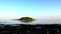 Bright evening sunshine, still, calm waters, rock pools and reef, in Looe Bay, Cornwall UK Royalty Free Stock Photo