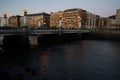 Evening walk along river in central part of Donostia or San Sebastian city, Basque Country, Spain