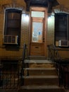 Front stoop with lights on at night