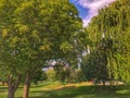 Evening walk at the park enjoying the warm summer temperature Royalty Free Stock Photo