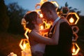 Evening wedding ceremony. The bride and Groom are on the background of the wedding arch. Royalty Free Stock Photo