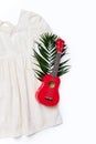 Evening white dress and little guitar flatlay