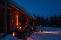 Evening winter cottage friends enjoy hot drinks