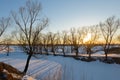 Winter landscape with thawed areas, ravines and trees