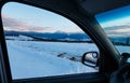 Evening winter mountain ridge view thru car windshield Royalty Free Stock Photo