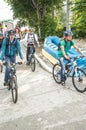 Bicyclists, adults and children, their portraits