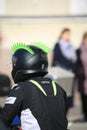 Biker in a helmet with two green ridges Royalty Free Stock Photo