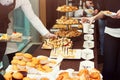 Event food catering table with various pastry and bakery foods