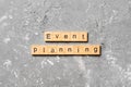 Event planning word written on wood block. Event planning text on table, concept Royalty Free Stock Photo