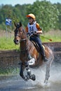 Eventer on horse is overcomes the Water jump Royalty Free Stock Photo