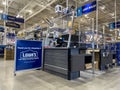 Everett, WA USA - circa July 2022: Angled view of a checkout counter inside a Lowes Home Improvement store Royalty Free Stock Photo