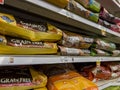 Everett, WA USA - circa June 2022: Angled close up of large bags of dry dog food for sale inside a Fred Meyer grocery store