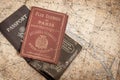 A studio shot of an antique Paris Tour Book with Included Map in Background