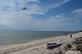 Young beach campers flying kite on Middle Cape Sable beach in Everglades. Royalty Free Stock Photo