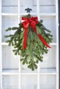 Evergreen Christmas Swag with Red Bow Royalty Free Stock Photo