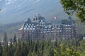 Evergreen forest surrounds the infamous haunted Fairmont Banff Springs Hotel