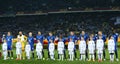 Everton players standing in line before UEFA Europa League Round of 16 second leg match between Dynamo and Everton with Dynamo fan Royalty Free Stock Photo