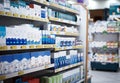 Every aisle is stocked with the health essentials you need. shelves stocked with various medicinal products in a