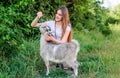 Every animal is different. woman vet feeding goat. farm and farming concept. Animals are our friends. happy girl love Royalty Free Stock Photo