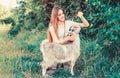 Every animal is different. woman vet feeding goat. farm and farming concept. Animals are our friends. happy girl love Royalty Free Stock Photo