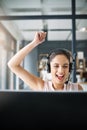 Every call is a win. an attractive young woman cheering while working in a call center. Royalty Free Stock Photo