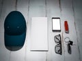 Every day carry man items collection: glasses, cap, knife. Royalty Free Stock Photo