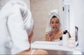 Every day routine with cleaning teeth. In the bathroom. Woman in white towel in head have care of herself Royalty Free Stock Photo