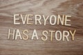 Every on has a story text message on wooden background Royalty Free Stock Photo