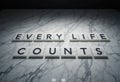 Every Life Counts Motivational Message on Marble Surface with Shadows Royalty Free Stock Photo