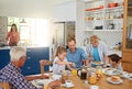 Every mealtime is family time. a multi generational family enjoying breakfast together at home. Royalty Free Stock Photo