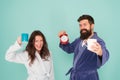 Every morning begins with coffee. Couple in bathrobes with mugs. Man with beard and sleepy woman enjoy morning coffee or