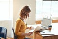 Every project comes with a design brief. an attractive young woman looking over some paperwork while working in a modern Royalty Free Stock Photo