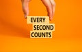 Every second counts symbol. Concept words Every second counts on wooden blocks on a beautiful orange table orange background. Royalty Free Stock Photo