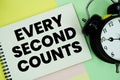 Every Second Counts text written on notepad with alarm clock on pastel background Royalty Free Stock Photo