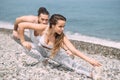 Stretching before everyday jogging on the beach Royalty Free Stock Photo