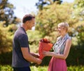 Every woman deserves flowers. a mature woman getting a bouquet of flowers from her husband. Royalty Free Stock Photo
