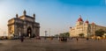 Every year thousands of tourist visit the most famous attractions of Mumbai - The Taj Mahal Palace Hotel and Gateway of India Royalty Free Stock Photo