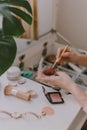 Everyday beauty routine. Make up artist. Dressing vanity. Women& x27;s hands. Pastel colors. In front of the mirror. Palettes Royalty Free Stock Photo