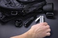 Everyday carry EDC items for men in black color - backpack, tactical belt, flashlight, watch and silver multi tool. Royalty Free Stock Photo