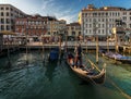 Everyday life of a gondolier. Walking on the bridges of the old city of Venice. Bright sun. The beauty of the ancient city. Italy Royalty Free Stock Photo