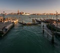 Everyday life of a gondolier. Walking on the bridges of the old city of Venice. Bright sun. The beauty of the ancient city. Italy Royalty Free Stock Photo