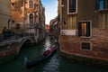 Everyday life of a gondolier. Walking on the bridges of the old city of Venice. Bright sun. The beauty of the ancient city. Italy Royalty Free Stock Photo